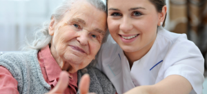 caregiver and patient doing a OK sign